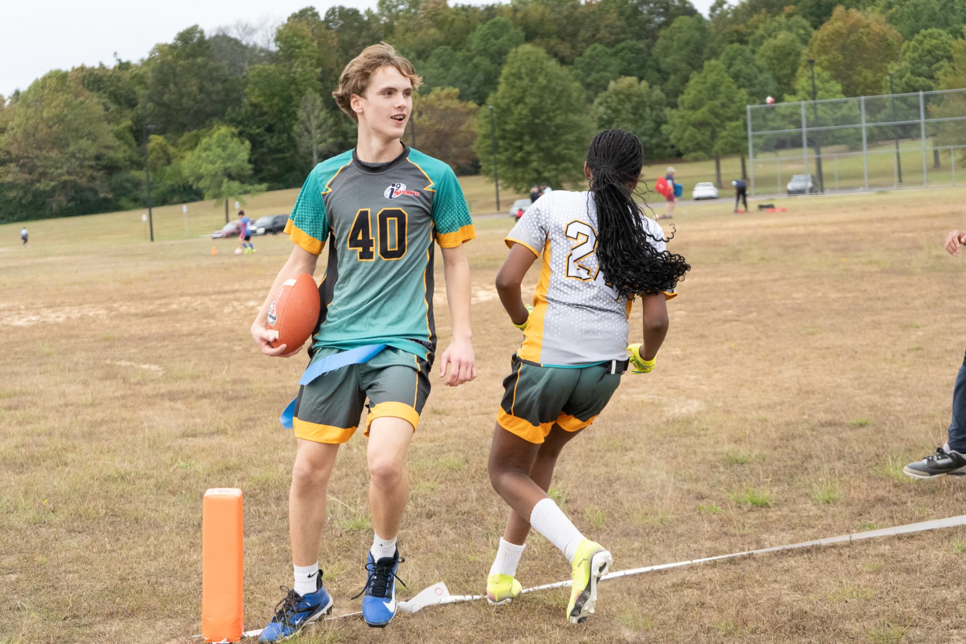 Older flag football players after a play